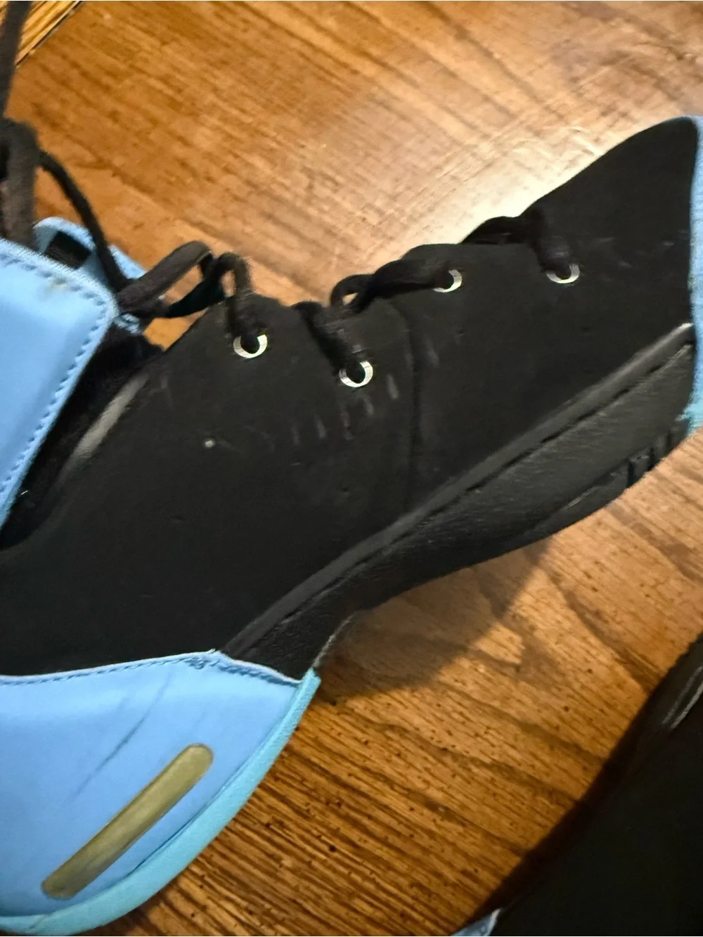 Kids Nike Melo 1.5 shoes black/university blue.